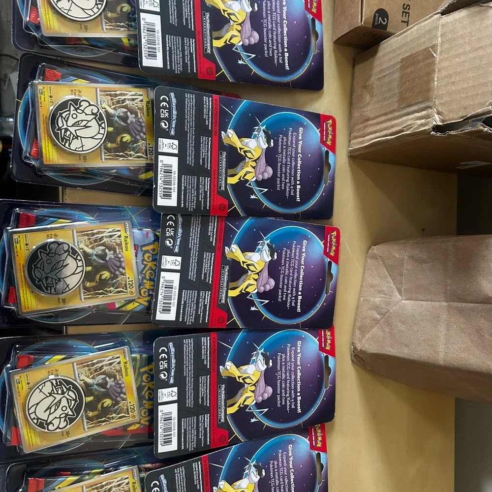 Lot of 10 Pokémon TCG booster double pack with two packs inside featuring Raikou